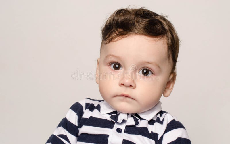 Portrait of a Cute Baby Boy Looking at Camera with His Big Eyes. Stock ...