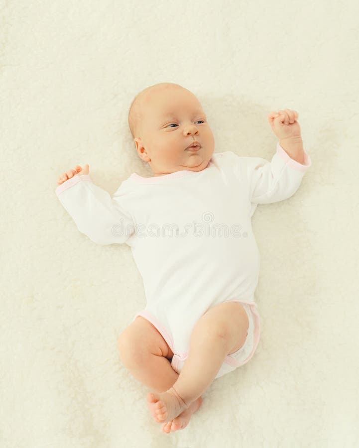 Portrait of cute baby lying on the bed at home royalty free stock image Portrait of cute baby lying on the bed at home royalty free stock image