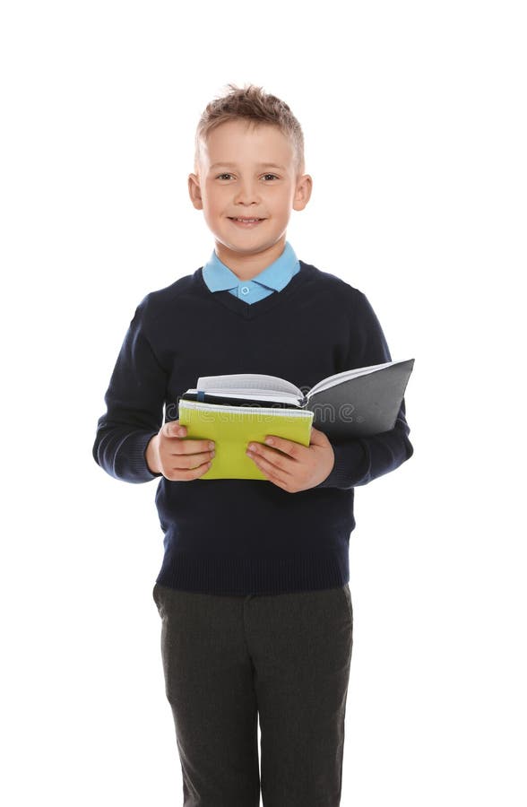 Portrait Of Cute Boy In School Uniform With Books On Whi