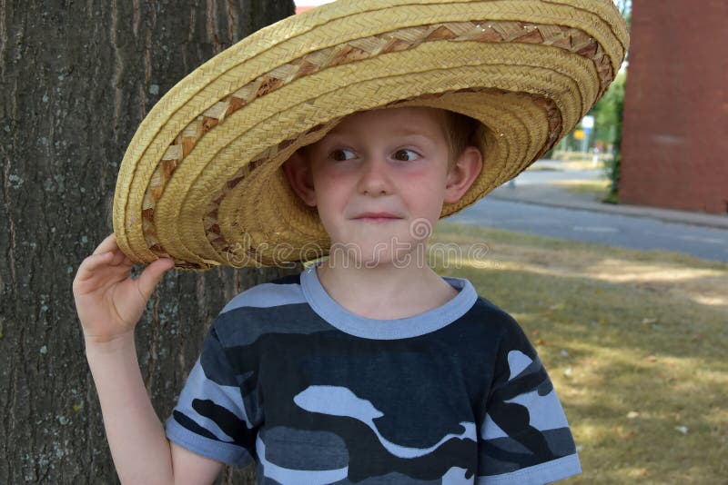 Preschooler wears a big mexican straw hat stock photos Preschooler wears a big mexican straw hat stock photos