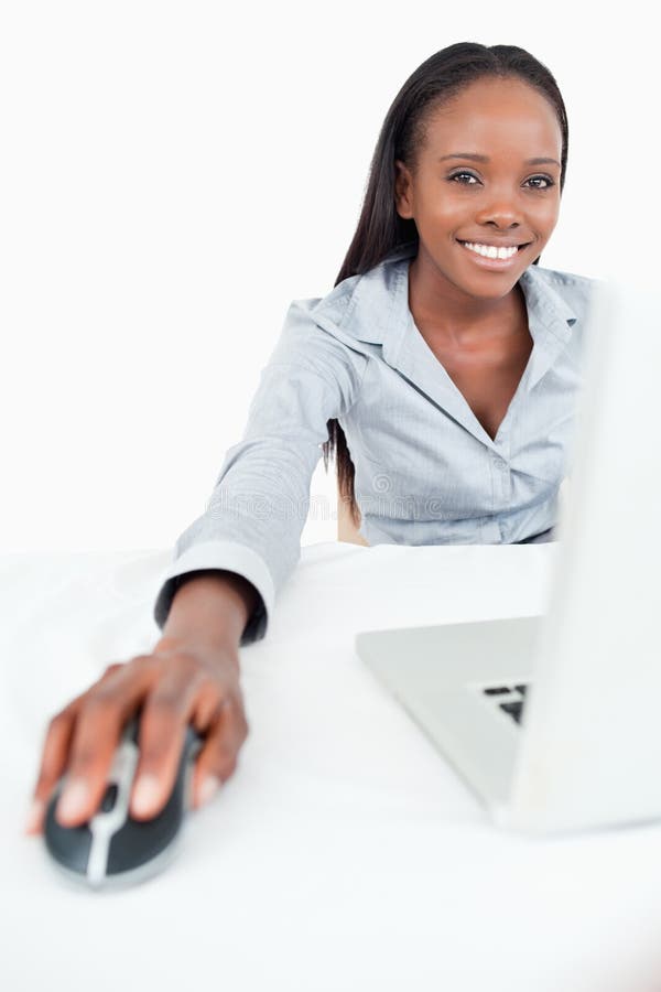 Portrait of a cute businesswoman using a laptop stock images