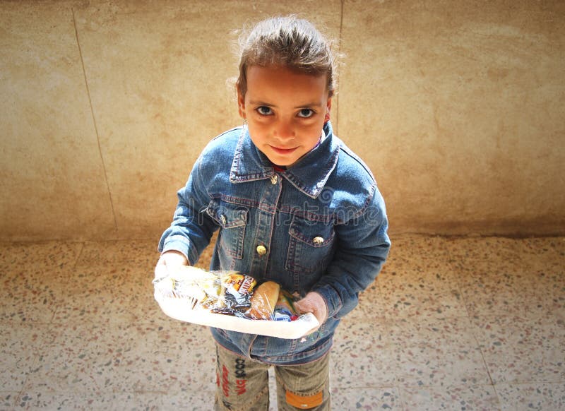 Portrait of a cute girl holding her meal