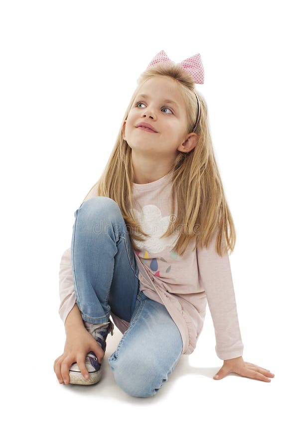 Portrait of a Adorable Little Girl Sitting on the Knees, Looking Up on ...