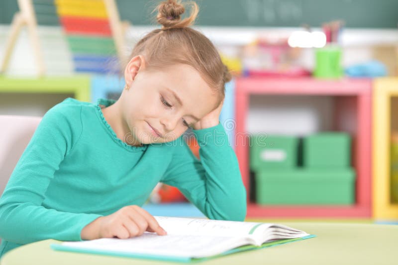 Portrait of a cute happy schoolgirl studying stock photos Portrait of a cute happy schoolgirl studying stock photos