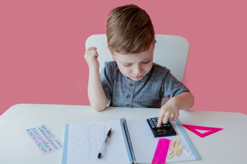 Make your homework. Ребенок сосредоточена задача. Ребенок пишет безграмотно. Child writing homework.