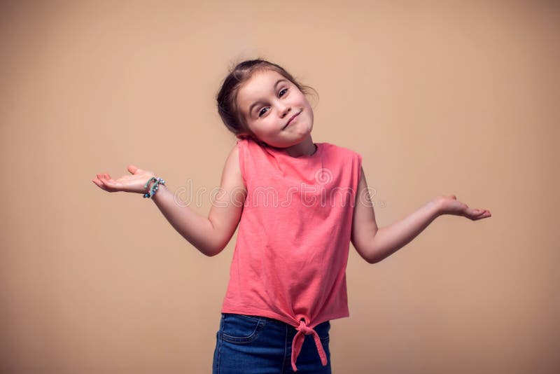 A Portrait of Kid Girl Showing Doubt Emotion Stock Photo - Image of  confused, expression: 184717434