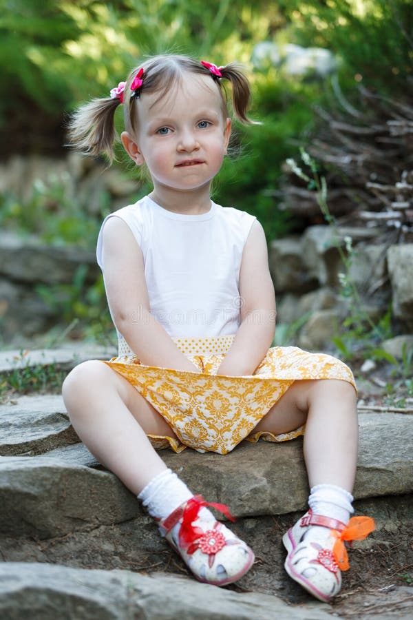 Portrait of a Cute Little Girl on the Background of Nature. she`s ...