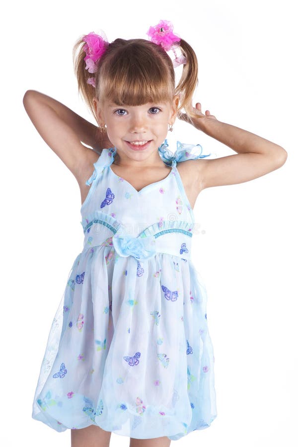 Portrait of a cute little girl in blue dress