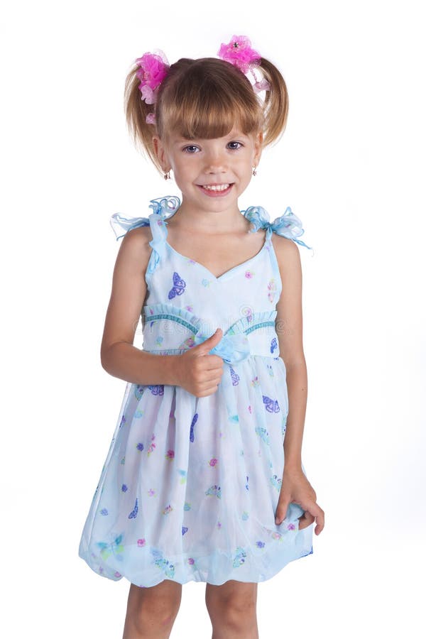 Portrait of a cute little girl in blue dress