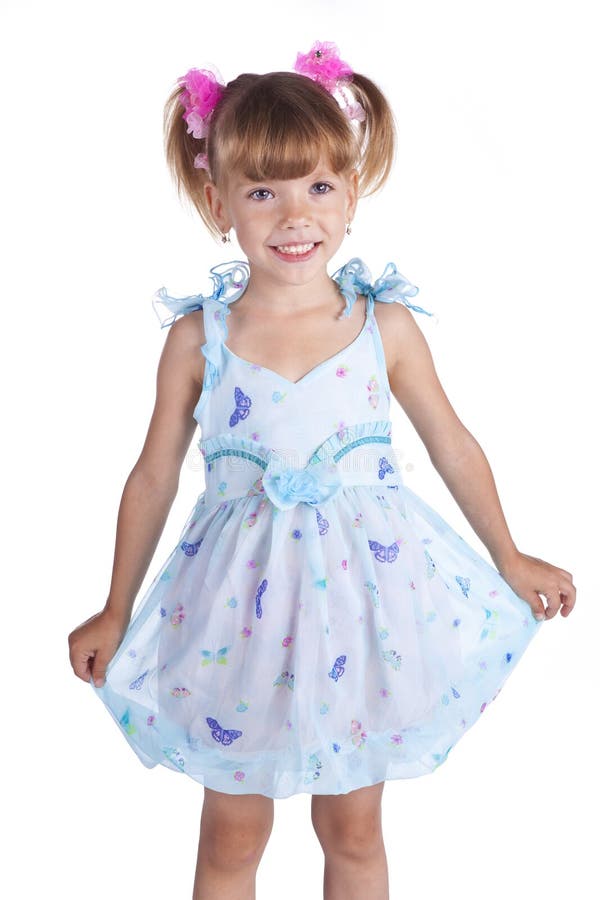 Portrait of a cute little girl in blue dress