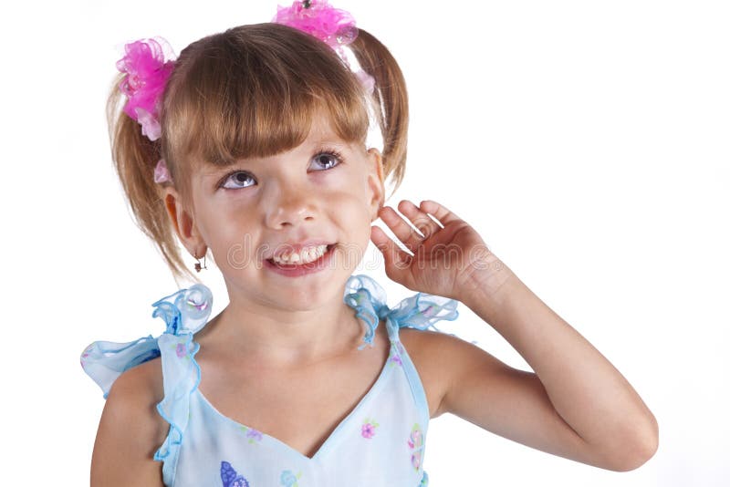 Portrait of a cute little girl in blue dress