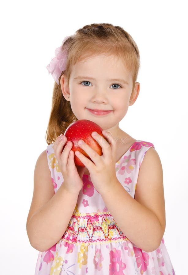 Portrait of cute little girl holding an apple