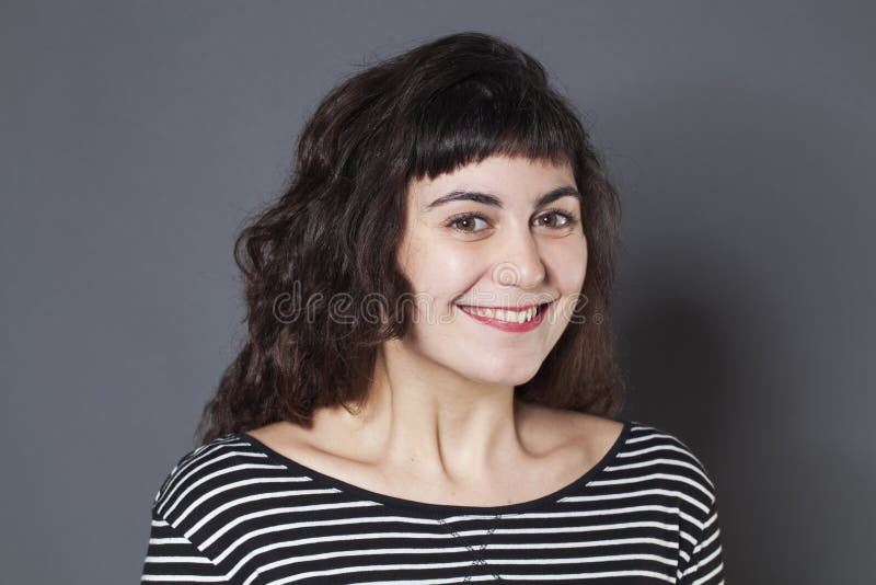 Portrait of cute 20s brunette girl with natural smile