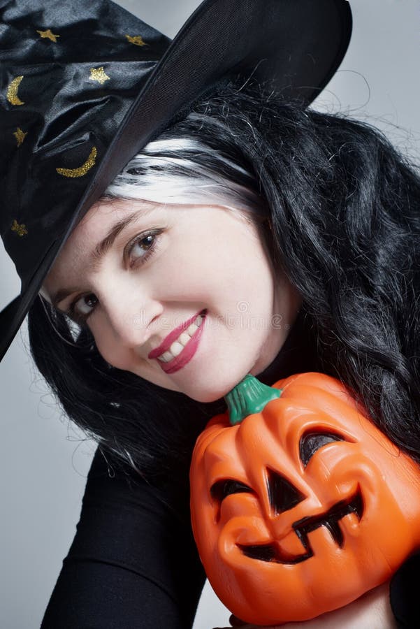 Teen Girl in Halloween Hat with Carved Pumpkin Stock Image - Image of  autumn, lying: 6091673