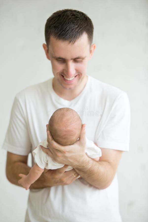 Portrait of dad playing with his baby