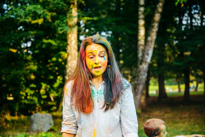 Portrait of dark long hair woman all in holi paints stock images Portrait of dark long hair woman all in holi paints stock images