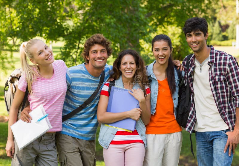 Group portrait of happy college friends standing in the campus. Group portrait of happy college friends standing in the campus