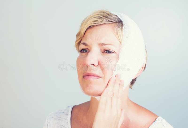 Closeup portrait of young woman achy girl suffering from terrible tooth pain. Closeup portrait of young woman achy girl suffering from terrible tooth pain