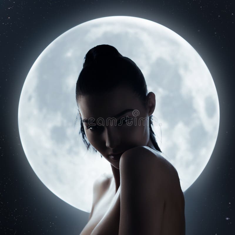 Fine art fashion studio portrait of a sensual woman against the night sky and a full moon. Silhouette of young adult mixed race Asian Caucasian model outdoors conceptual photo. Fine art fashion studio portrait of a sensual woman against the night sky and a full moon. Silhouette of young adult mixed race Asian Caucasian model outdoors conceptual photo