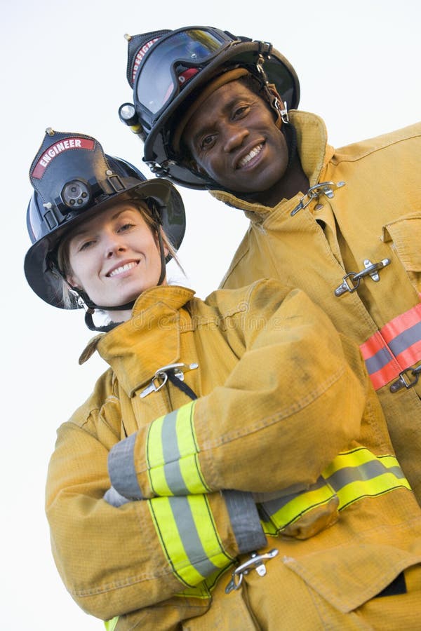 Portrait of firefighters smiling at camera. Portrait of firefighters smiling at camera