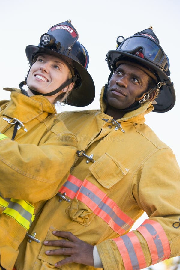 Portrait of firefighters looking away from camera. Portrait of firefighters looking away from camera