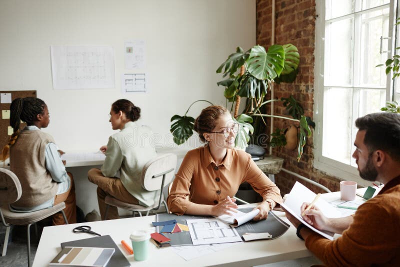 Female Designer Working with Team stock photos