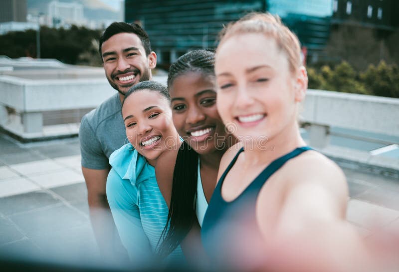 Portrait Of A Diverse Group Of Happy Sporty People Taking Selfies While 