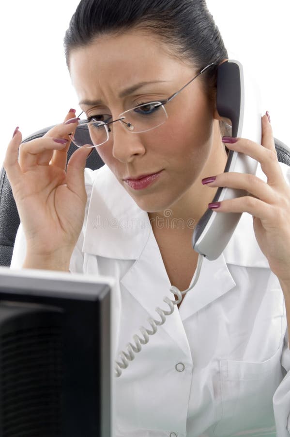 Portrait of doctor talking on phone