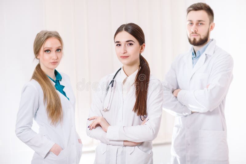 Portrait of Doctors in White Coats in the Hospital Ward Stock Photo