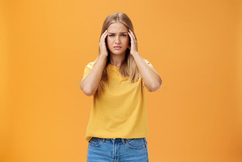 Portrait Of Drained Sad Young Woman With Tanned Skin And Fair Hair 