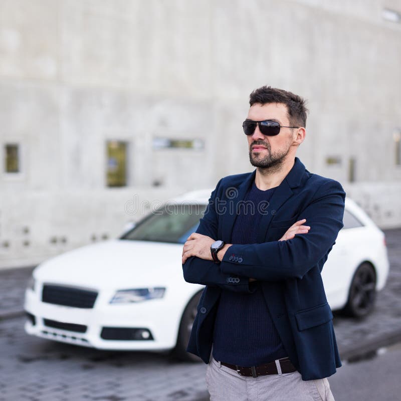 Photo of a Man Posing in Front of a White Car · Free Stock Photo