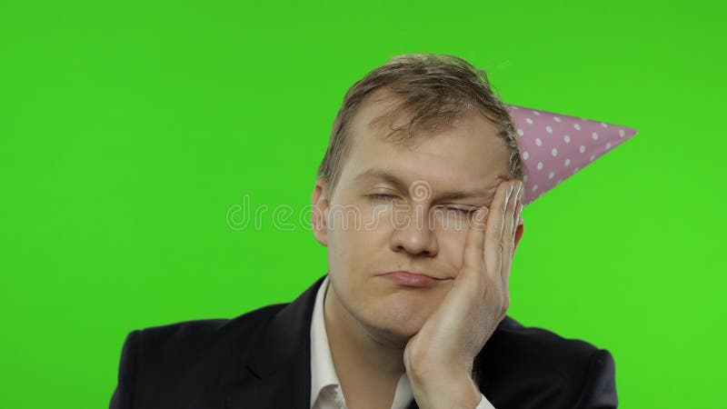 Drunk Sleepy Businessman In Festive Cap Blowing A Whistle Hangover Chroma Key Stock Video