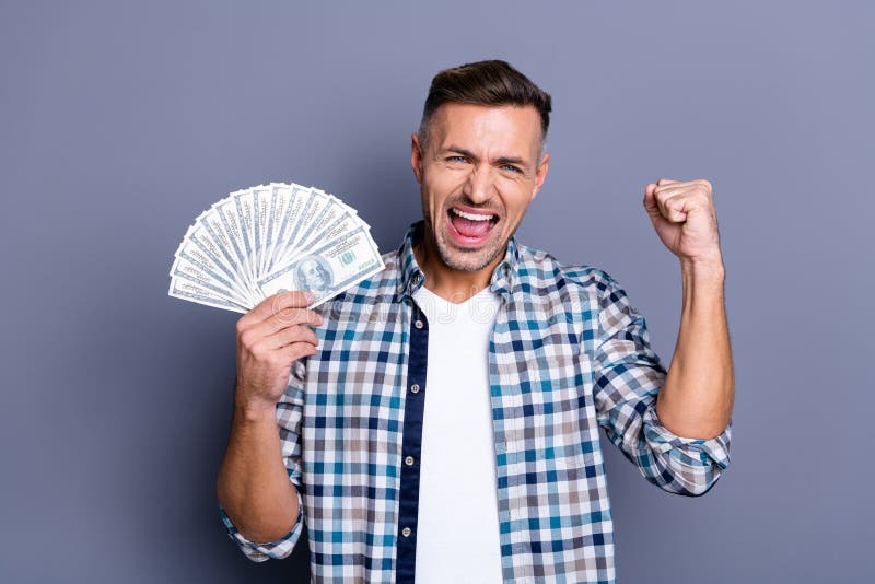 Portrait of ecstatic lucky man raise fists scream shout yeah have achievements aims champion casino triumph wages royalty free stock photography Portrait of ecstatic lucky man raise fists scream shout yeah have achievements aims champion casino triumph wages royalty free stock photography