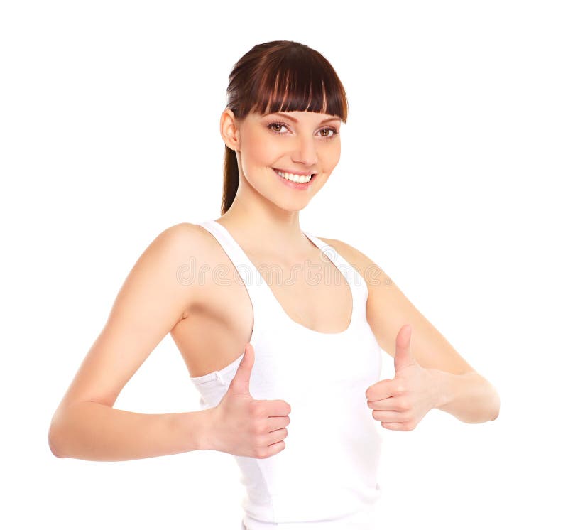 Portrait of a young and attractive brunette Caucasian woman holding thumbs up. The image is taken in a studio, isolated on a white background. Portrait of a young and attractive brunette Caucasian woman holding thumbs up. The image is taken in a studio, isolated on a white background.