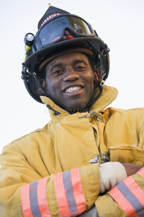 Portrait of a firefighter smiling at camera. Portrait of a firefighter smiling at camera