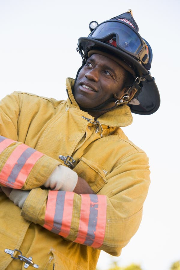 Portrait of a firefighter looking away from camera. Portrait of a firefighter looking away from camera