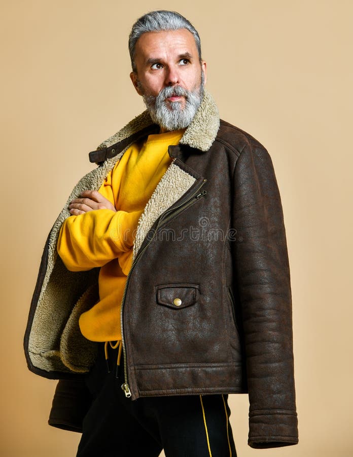 Portrait of elder stylish rich man with a beard and mustache in a leather winter coat stock photo Portrait of elder stylish rich man with a beard and mustache in a leather winter coat stock photo