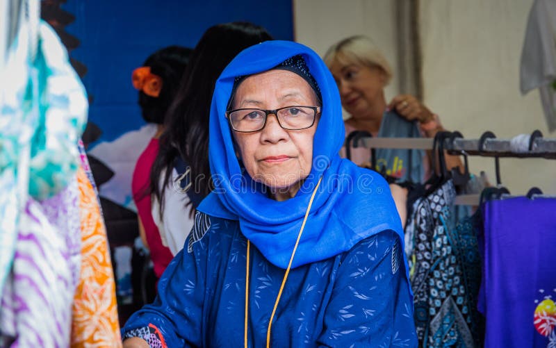 Moscow,Park on Krasnaya Presnya,August 05, 2018: Portrait of an elderly woman from Indonesia with glasses looking at the camera. stock photo Moscow,Park on Krasnaya Presnya,August 05, 2018: Portrait of an elderly woman from Indonesia with glasses looking at the camera. stock photo
