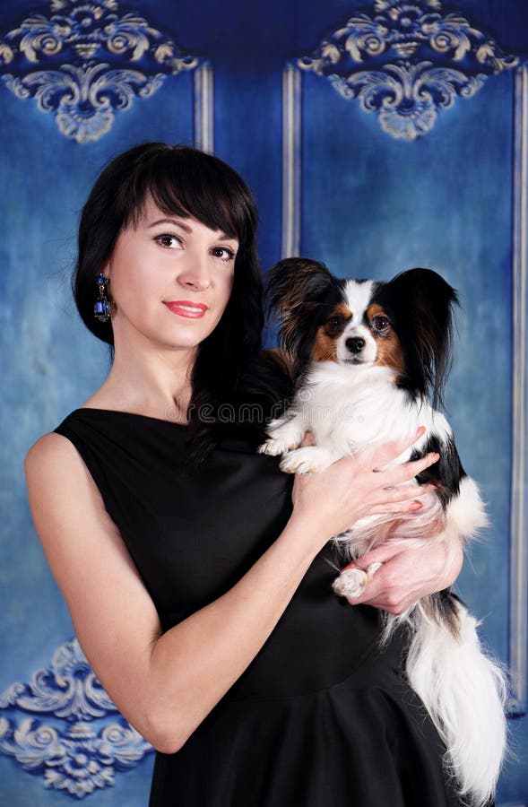 Portrait of elegant lady with a dog