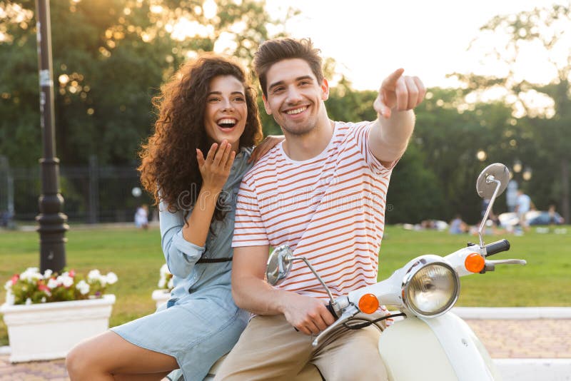 https://thumbs.dreamstime.com/b/portrait-european-couple-man-woman-sitting-together-motorcycle-men-women-city-park-131585073.jpg