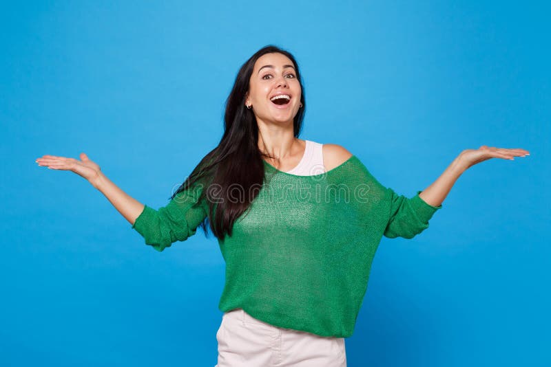 Portrait of Excited Amazed Young Woman in Green Casual Clothes Keeping ...