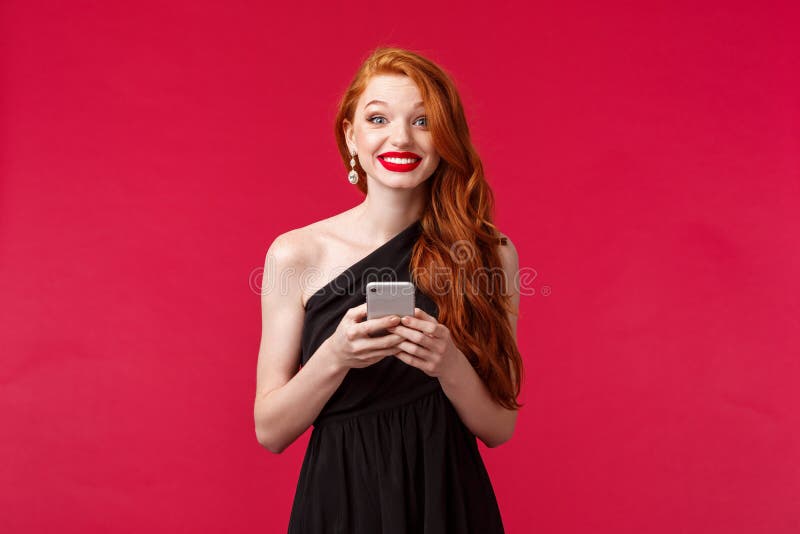 Portrait Of Excited And Amused Redhead Woman Wearing Black Dress On