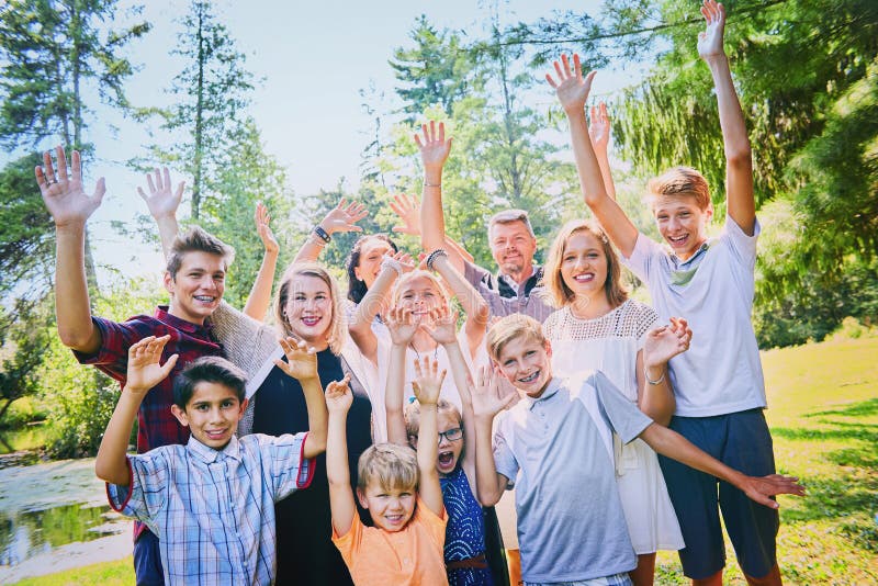 Portrait of excited mature parents with children