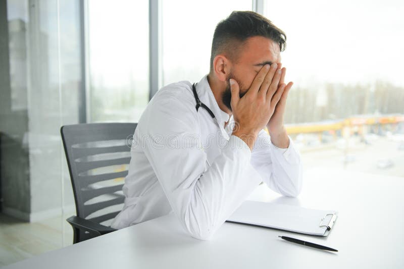 Portrait Of Exhausted Tired Young Arab Male Doctor After Hard Day At