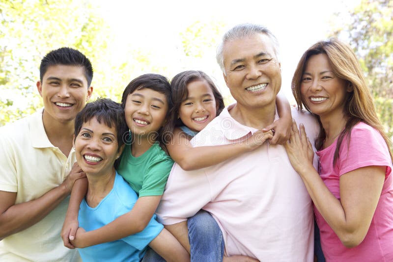 Portrait Of Extended Asian Family Group In Park Smiling. Portrait Of Extended Asian Family Group In Park Smiling