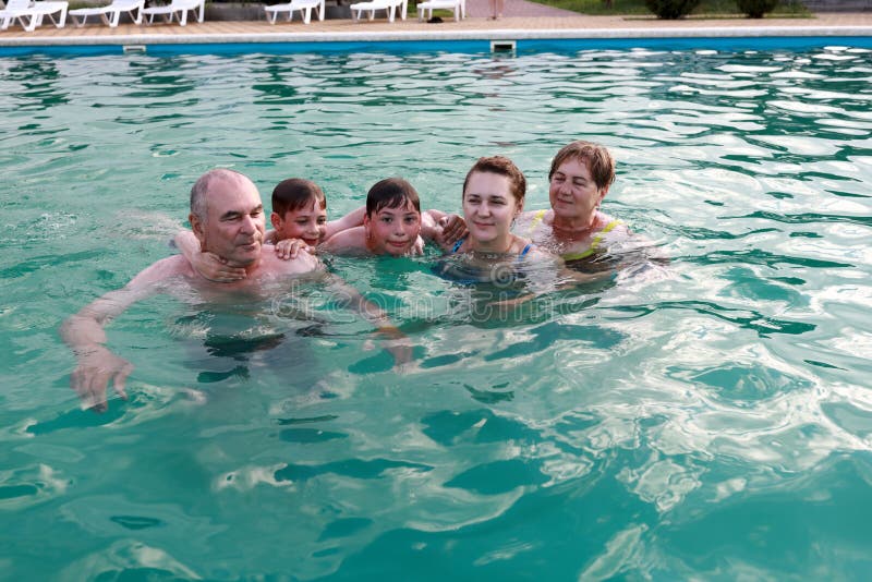 Portrait of family in open pool royalty free stock image