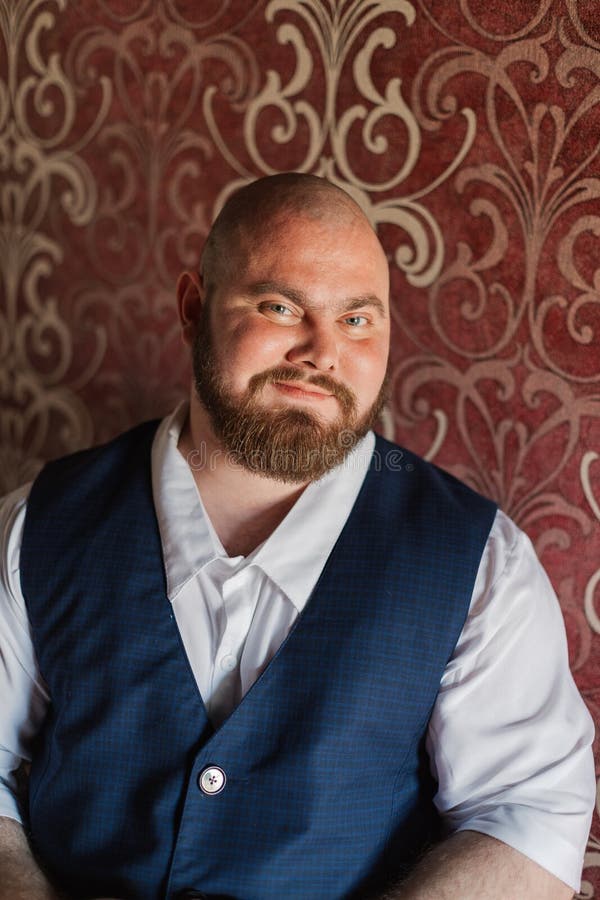 Portrait of a Fat Man with Suspenders on His Pants. Stock Photo Image