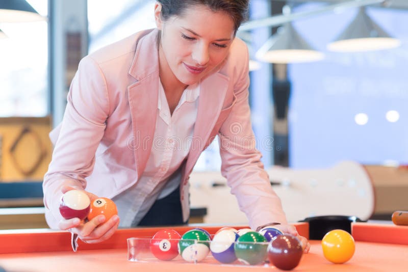 Female Billiard Player with Cue Poses at the Table Stock Photo - Image