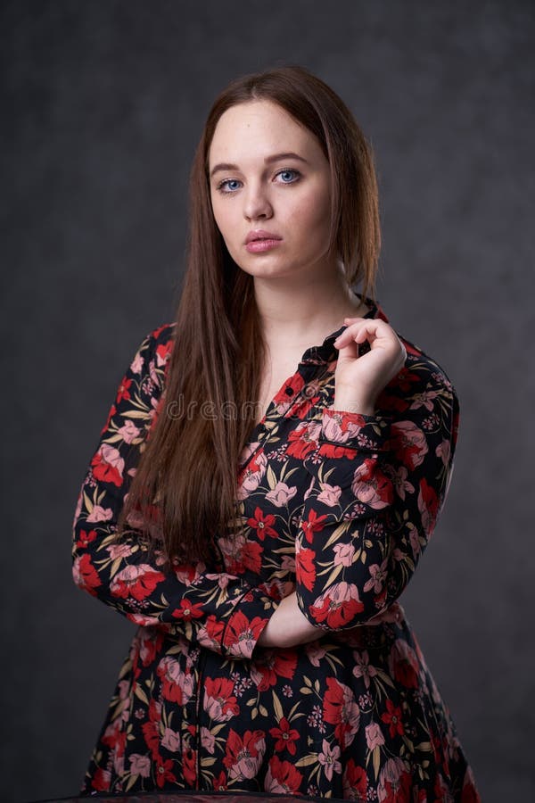 Portrait of a female in a colored dress on gray background royalty free stock photos Portrait of a female in a colored dress on gray background royalty free stock photos