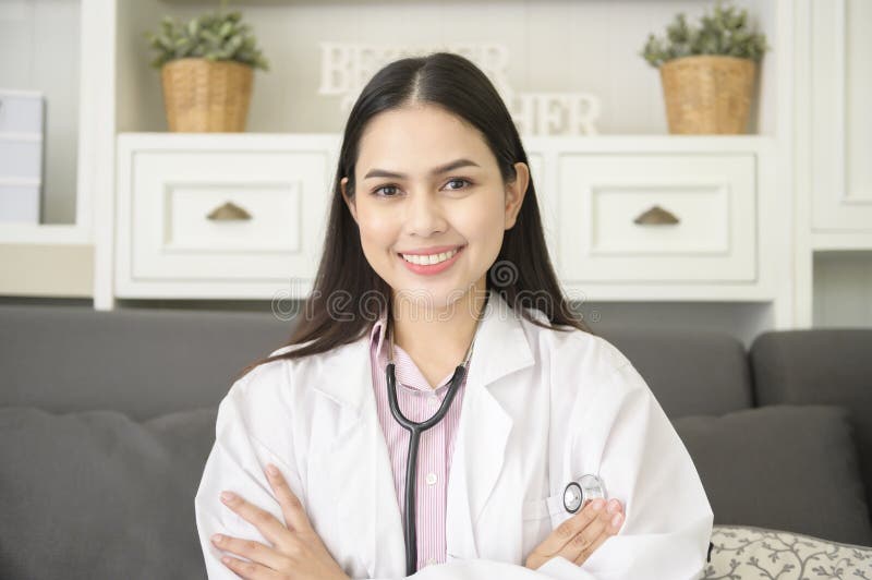 Portrait of Female Doctor with Stethoscope at Office and Smiling at